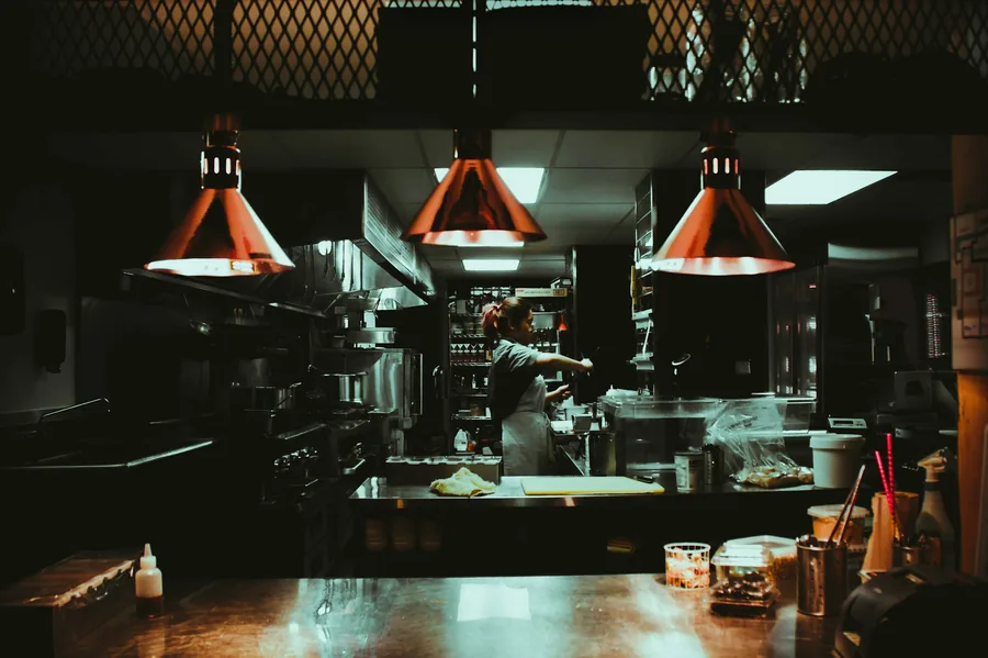 A dim restaurant interior after hours, when a lost customer is a quiet, invisible cost